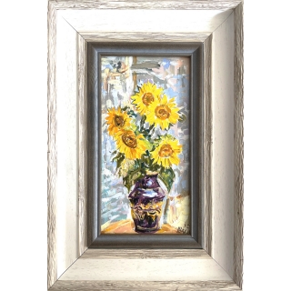 Bouquet of sunflowers in a blue vase
